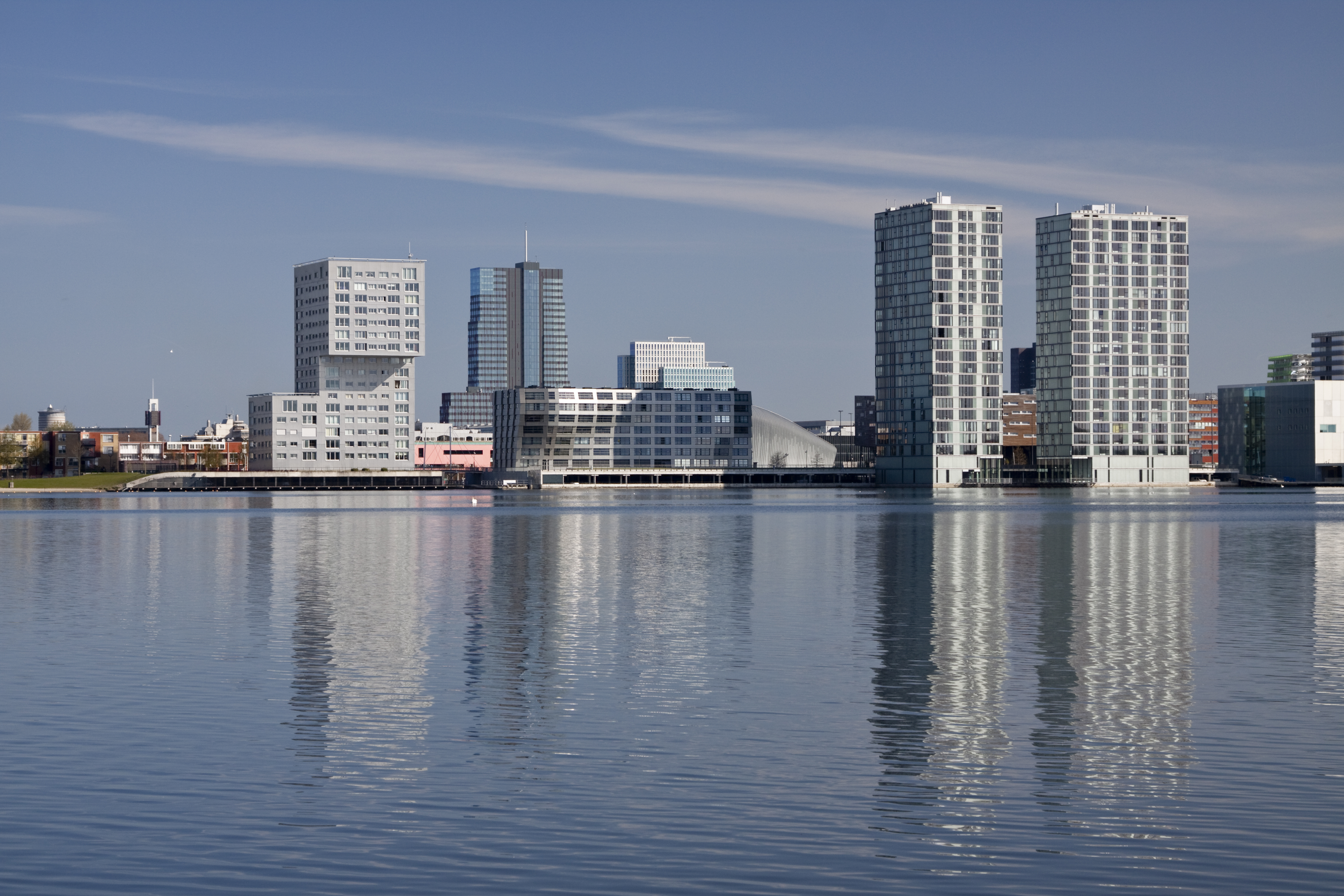 View of tall buildings reflection on water